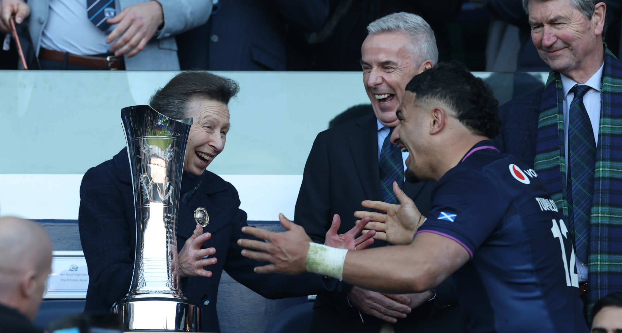 Princess Anne pretending to hug a rugby player