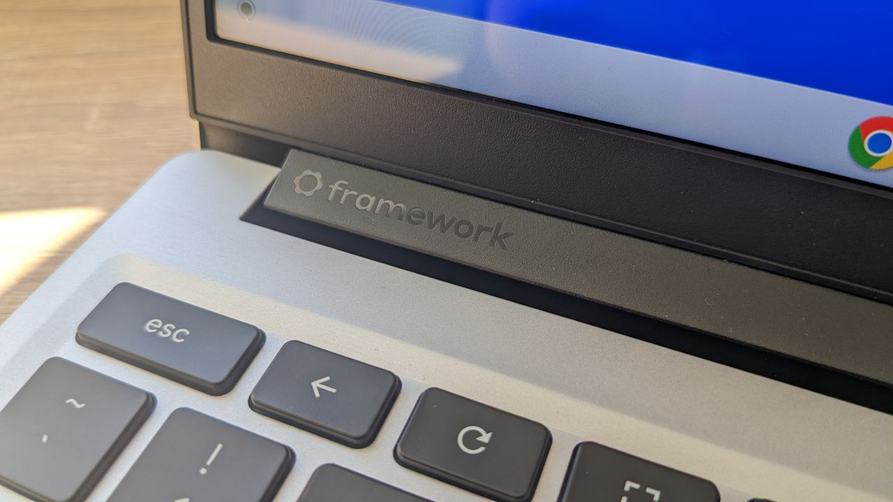 The Framework Laptop Chromebook Edition photographed on a wooden desk.