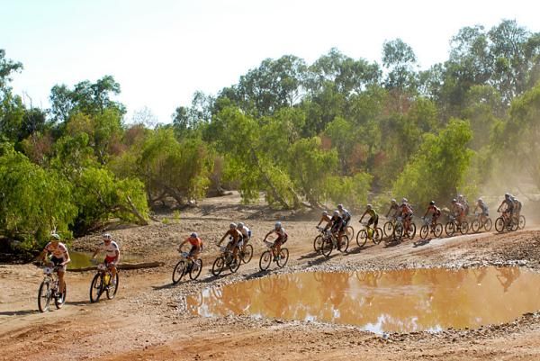 Racers head out of the town of Laura