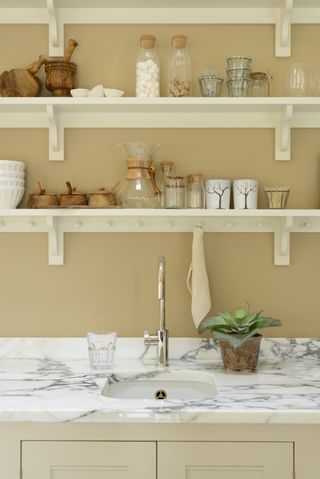 How to design a Shaker kitchen: Kitchen sink with shelves and peg rail above