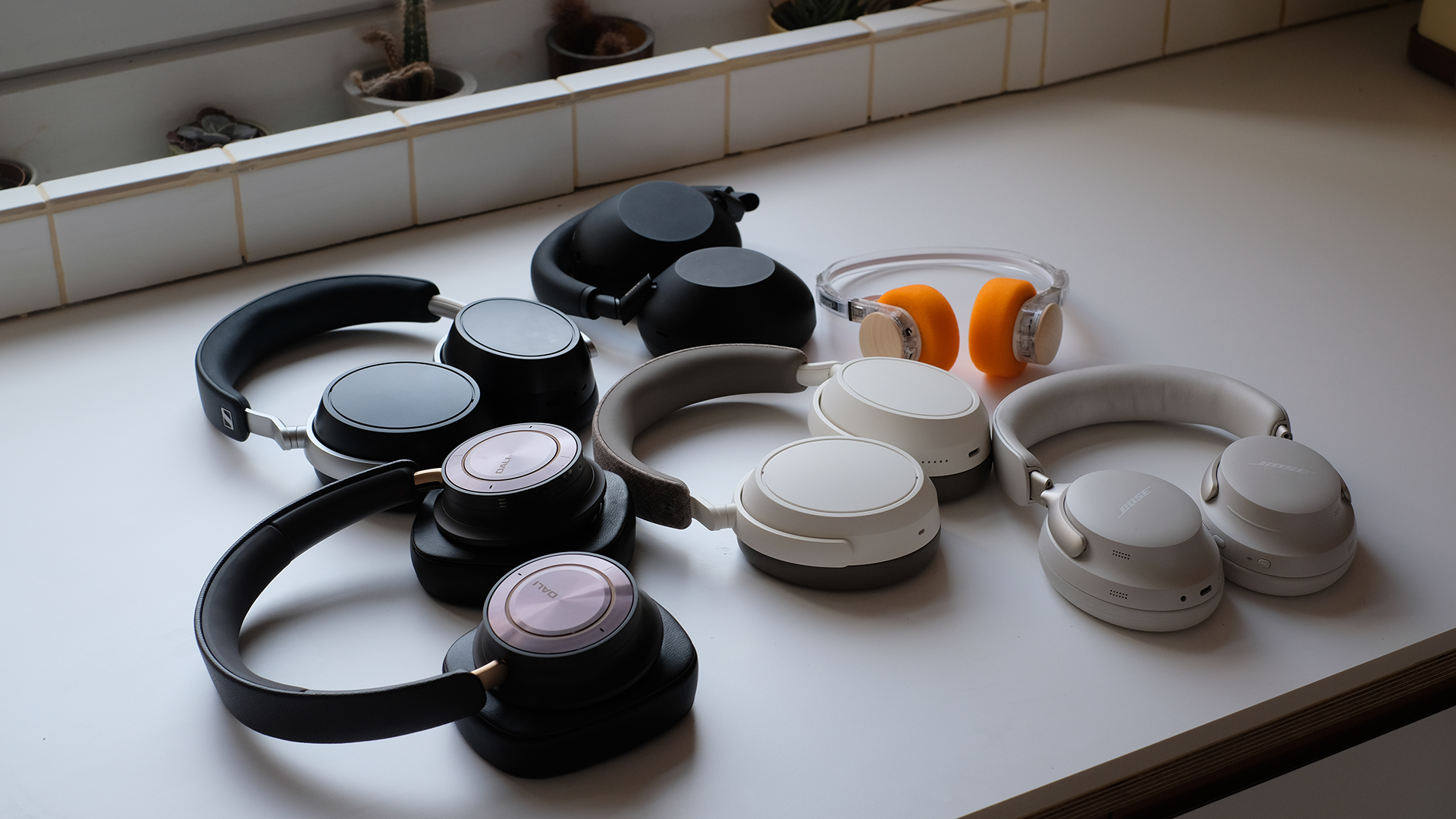 Wired and Wireless headphones on desktops.