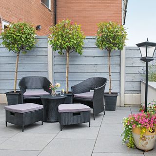 outdoor with chairs and table with plants on pots