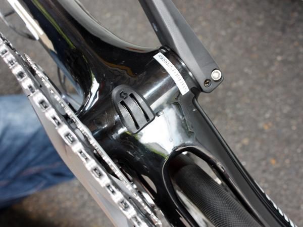 Shift cables are directed around the bottom bracket shell with this tidy guide.