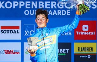 US rider Andrew "AJ" August celebrate on the podium after the junior men's race during the Koppenbergcross, the first race (out of eight) of the X2O Badkamers trophy, in Melden, on Tuesday 01 November 2022. BELGA PHOTO DAVID PINTENS (Photo by DAVID PINTENS / BELGA MAG / Belga via AFP) (Photo by DAVID PINTENS/BELGA MAG/AFP via Getty Images)