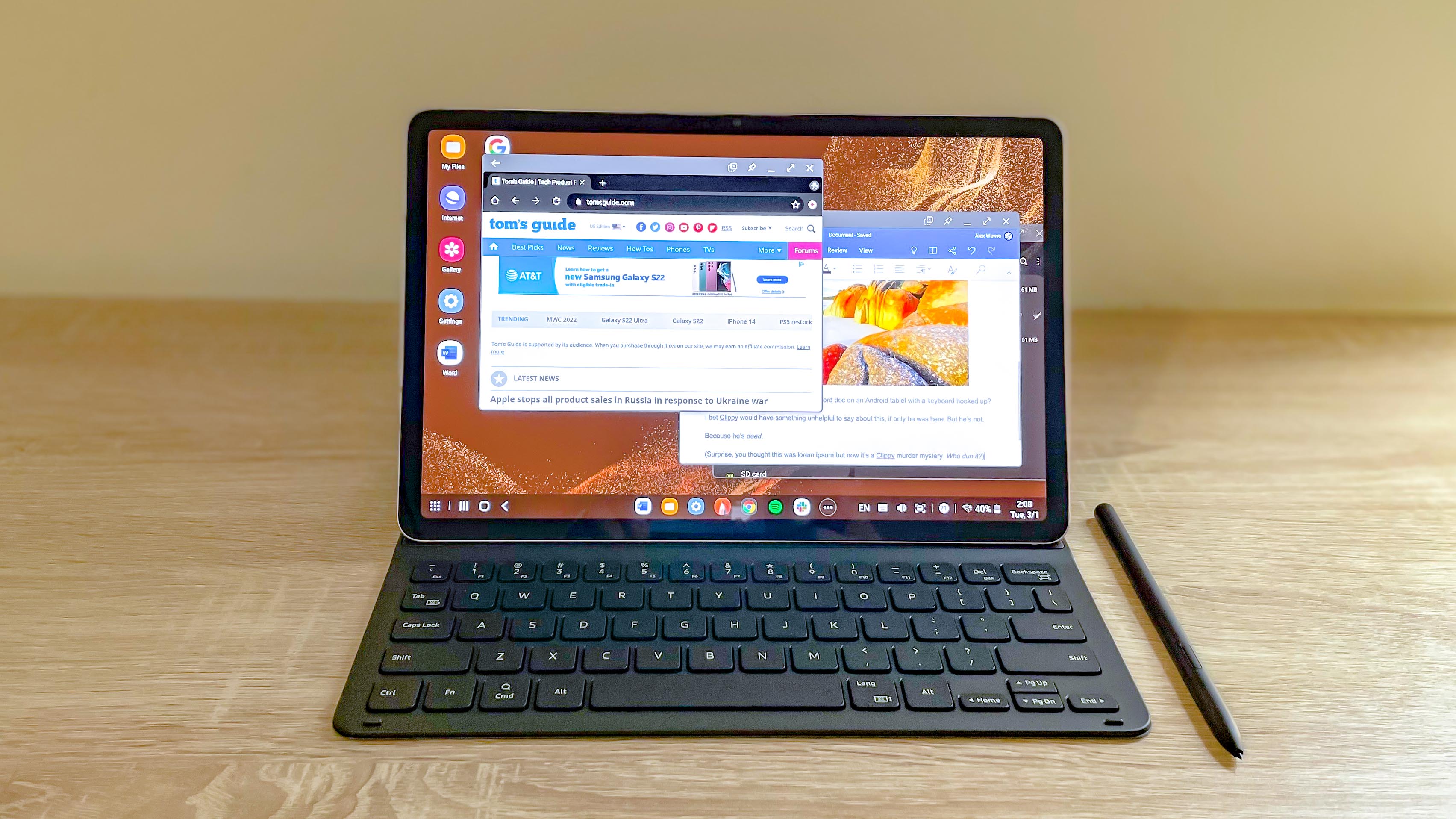 Samsung Galaxy Tab S8 sitting open on desk in keyboard cover with DeX mode running