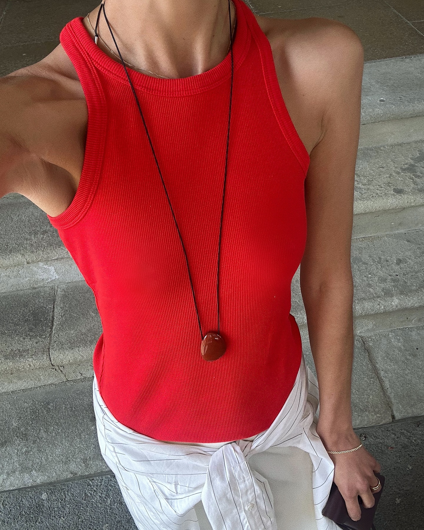 Santina Harrison wears a red tank top.