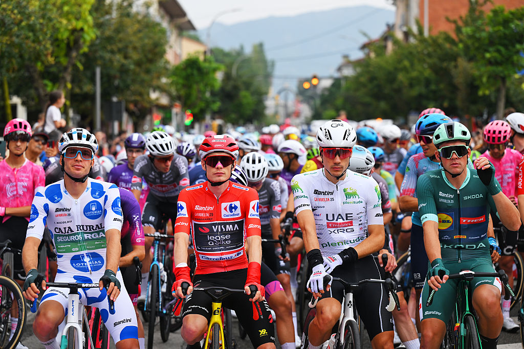 OLOT, SPAIN - AUGUST 28: (L-R) Joel Nicolau of Spain and Team Caja Rural - Seguros RGA - Polka Dot Mountain Jersey, Jonas Vingegaard of Denmark and Team Visma | Lease a Bike - Red Leader Jersey, Juan Ayuso of Spain and UAE Team Emirates - XRG - White Best Young Rider Jersey and Mads Pedersen of Denmark and Team Lidl - Trek - Green Points Jersey prior to the La Vuelta - 80th Tour of Spain 2025, Stage 6 a 170.3km stage from Olot to Pal - Andorra 1900m / #UCIWT / on August 28, 2025 in Olot, Spain. (Photo by Tim de Waele/Getty Images)