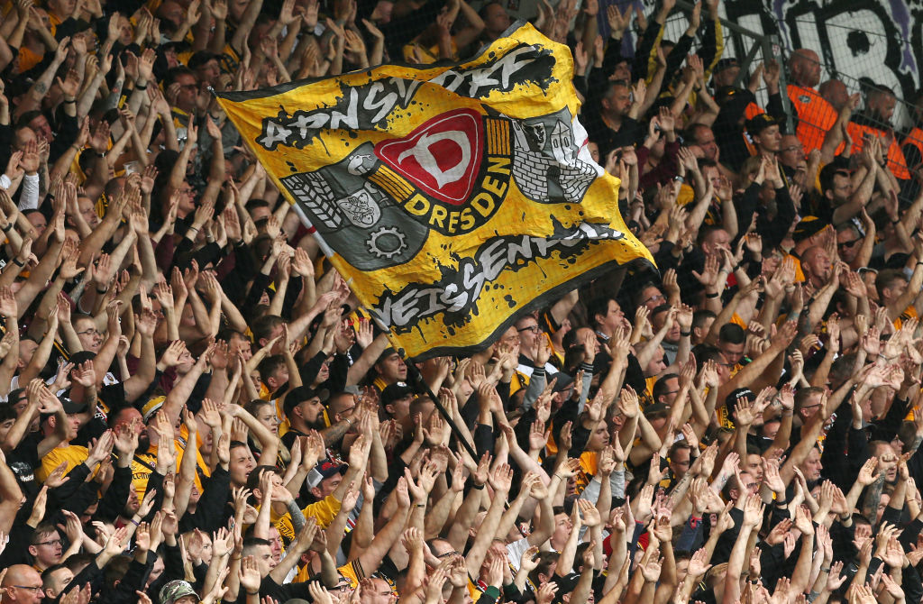 Fans of Dresden are pictured during the 3.Liga match between Erzgebirge Aue and SG Dynamo Dresden at Erzgebirgsstadion on August 28, 2022 in Aue, Germany.