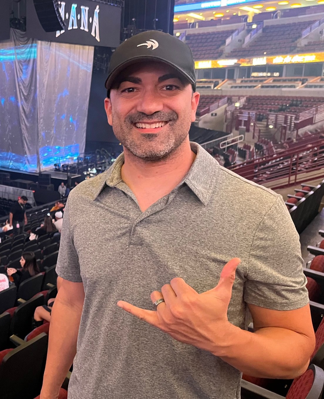 Smiling headshot of Nelson Lugo at a concert setup.