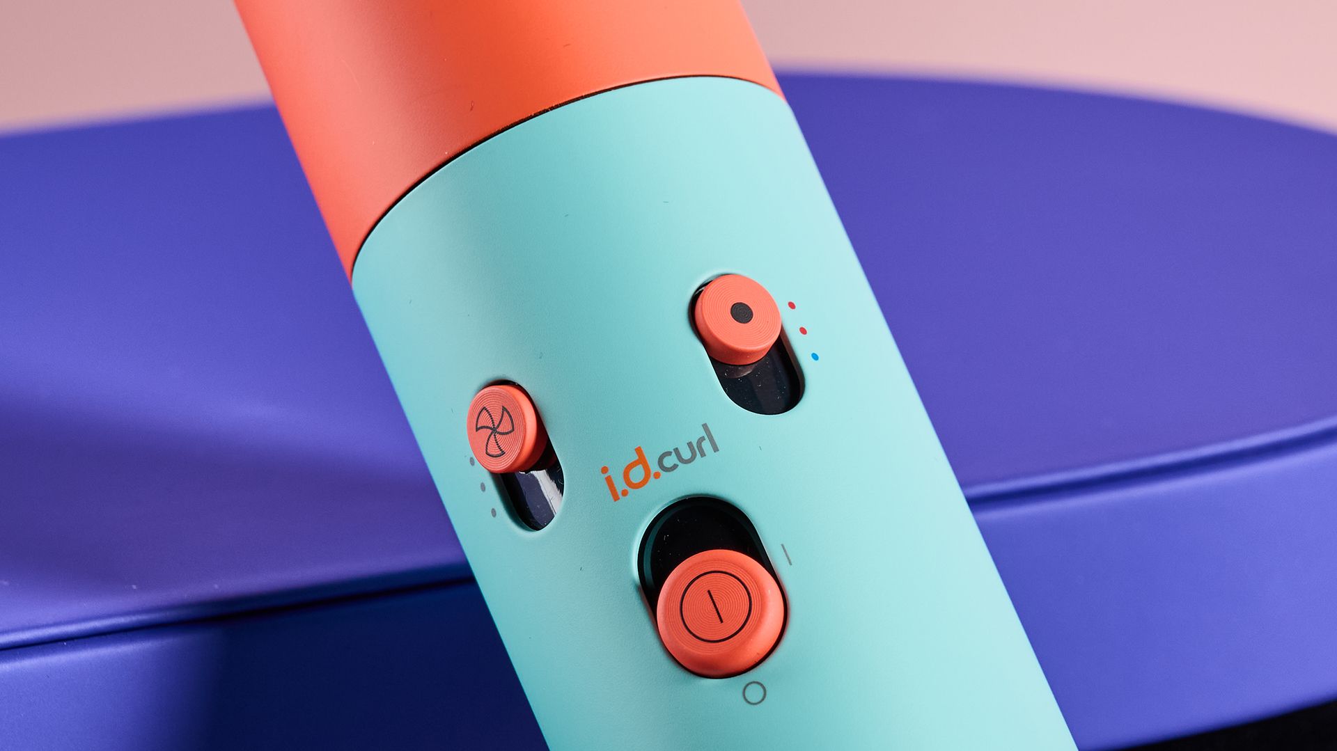 Close up of controls on Dyson Airwrap i.d., leaning against storage box
