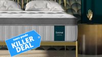 A close up image of the Leesa Legend Chill hybrid mattress on a gold bed frame