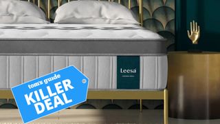 A close up image of the Leesa Legend Chill hybrid mattress on a gold bed frame