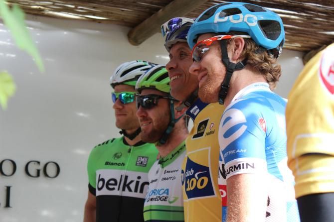 A lucky fan poses with a number of the new riders at MTN-Qhubeka.