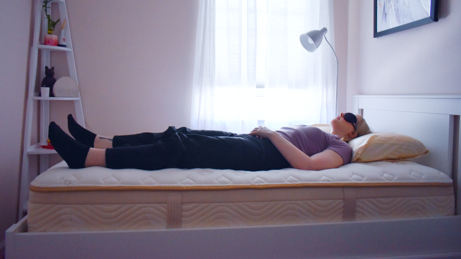 Mattress tester sleeps on the Saatva Memory Foam Hybrid mattress