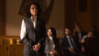 Tatiana Maslany's Jennifer Walters stands in a court room with her clothes ripped after turning into She-Hulk
