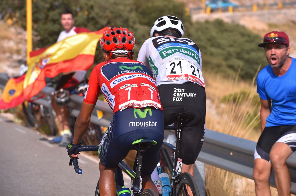 Race leader Nairo Quintana just sitting off Chris Froome's rear wheel