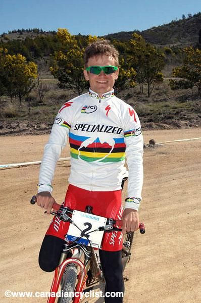 South Africa's Burry Stander, who won the previous day's Under 23 men's title, shows off his new kit.