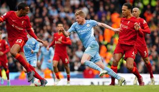 Manchester City’s Kevin De Bruyne is fouled by Liverpool’s Virgil van Dijk (right) during the Premier League match at the Etihad Stadium,