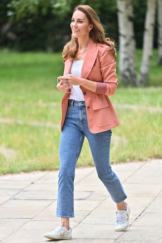 Kate Middleton wears Veja trainers, jeans and a pink blazer as she arrives at Natural History Museum to see the urban nature project on June 22, 2021 in London, England.