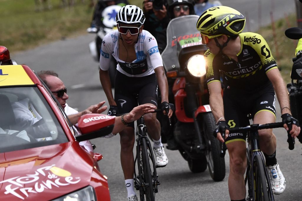 Great Britains Simon Yates R followed by Colombias Egan Bernal wearing the best youngs white jersey chats with Tour de France director Christian Prudhomme after the race was stopped due to bad weather conditions in the last 20 kilometers during the nineteenth stage of the 106th edition of the Tour de France cycling race between SaintJeandeMaurienne and Tignes in Tignes on July 26 2019 Photo by Marco Bertorello AFP Photo credit should read MARCO BERTORELLOAFP via Getty Images