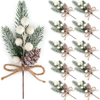 Artificial pine branches with white berries and pine cones:&nbsp;£14.89, Amazon