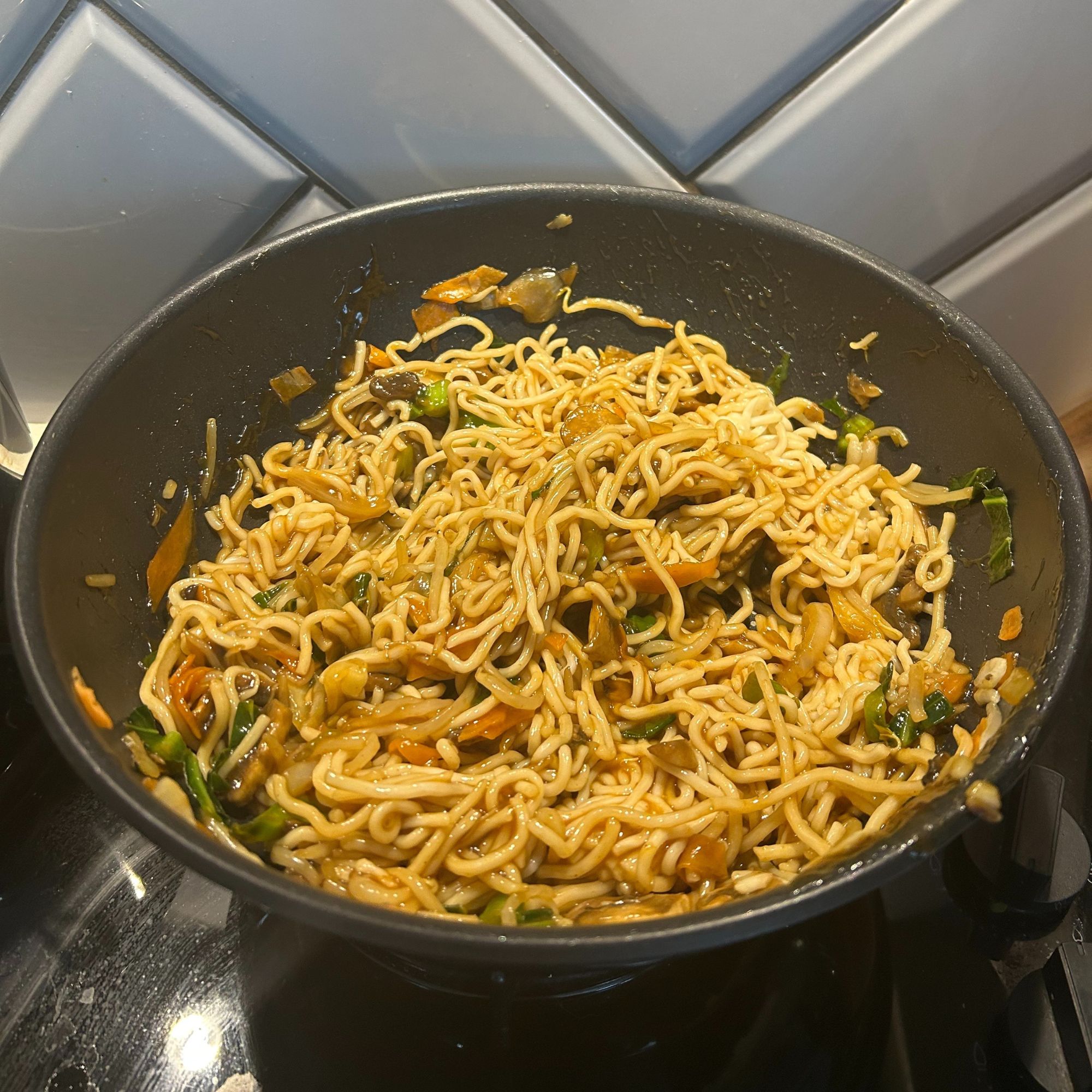 Tefal Ingenio Emotion 22-Piece Pan Set - wok in use while cooking stir fry