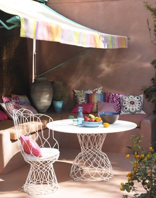 Exotic style outdoor living with pale pink stone