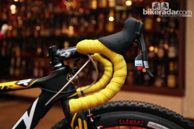 The SRAM Red DoubleTap levers are mounted high on Zipp Service Course CSL bars.