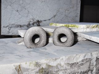 Two grey marble objects