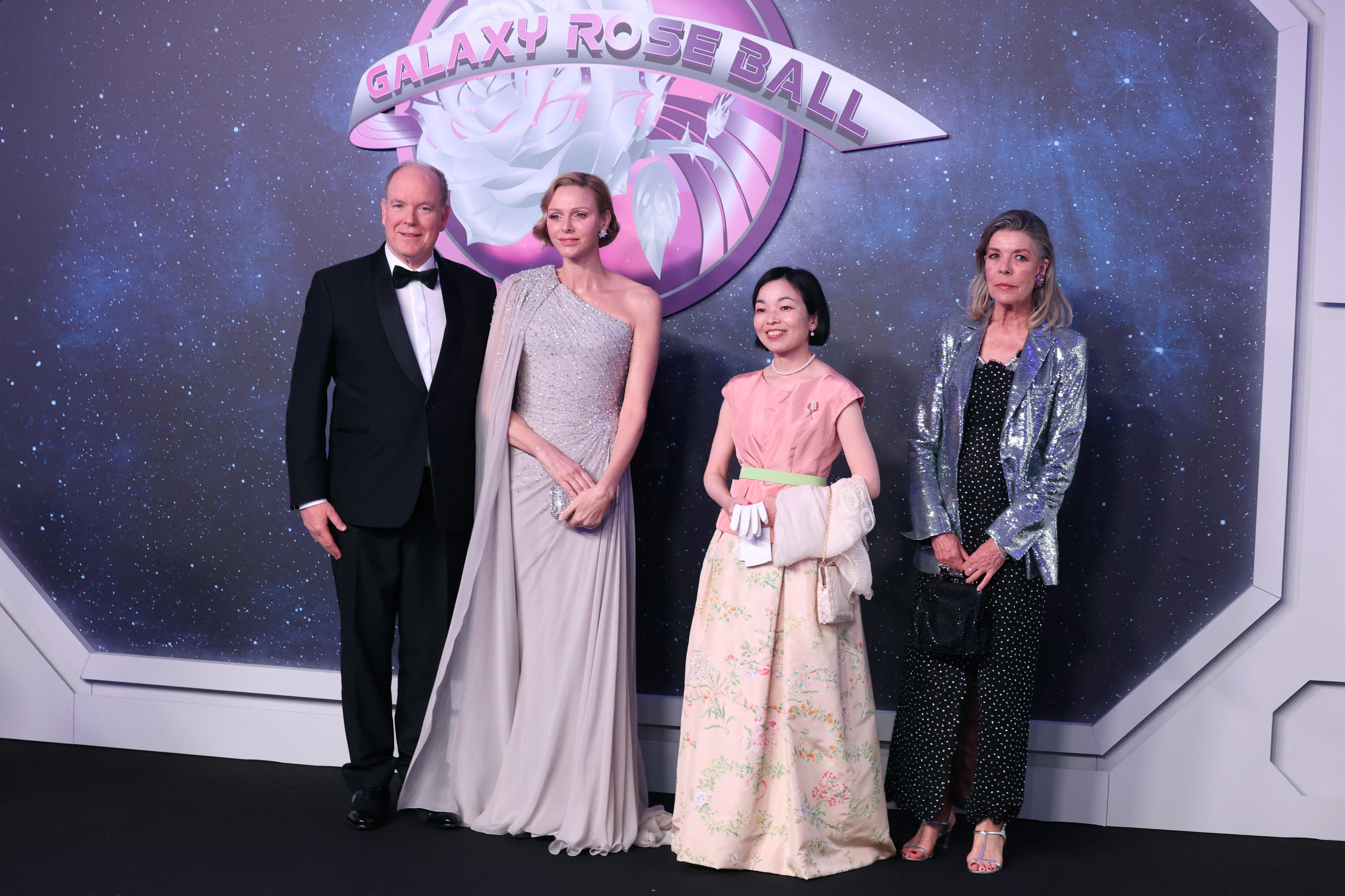 Princess Charlene of Monaco attends the Rose Ball 2026 Photocall on March 21, 2026 wearing a glittering sequin caped gown from Elie Saab