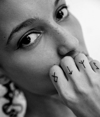 black and white image of woman with hand tattoos by ephemeral tattoos which fade after a year