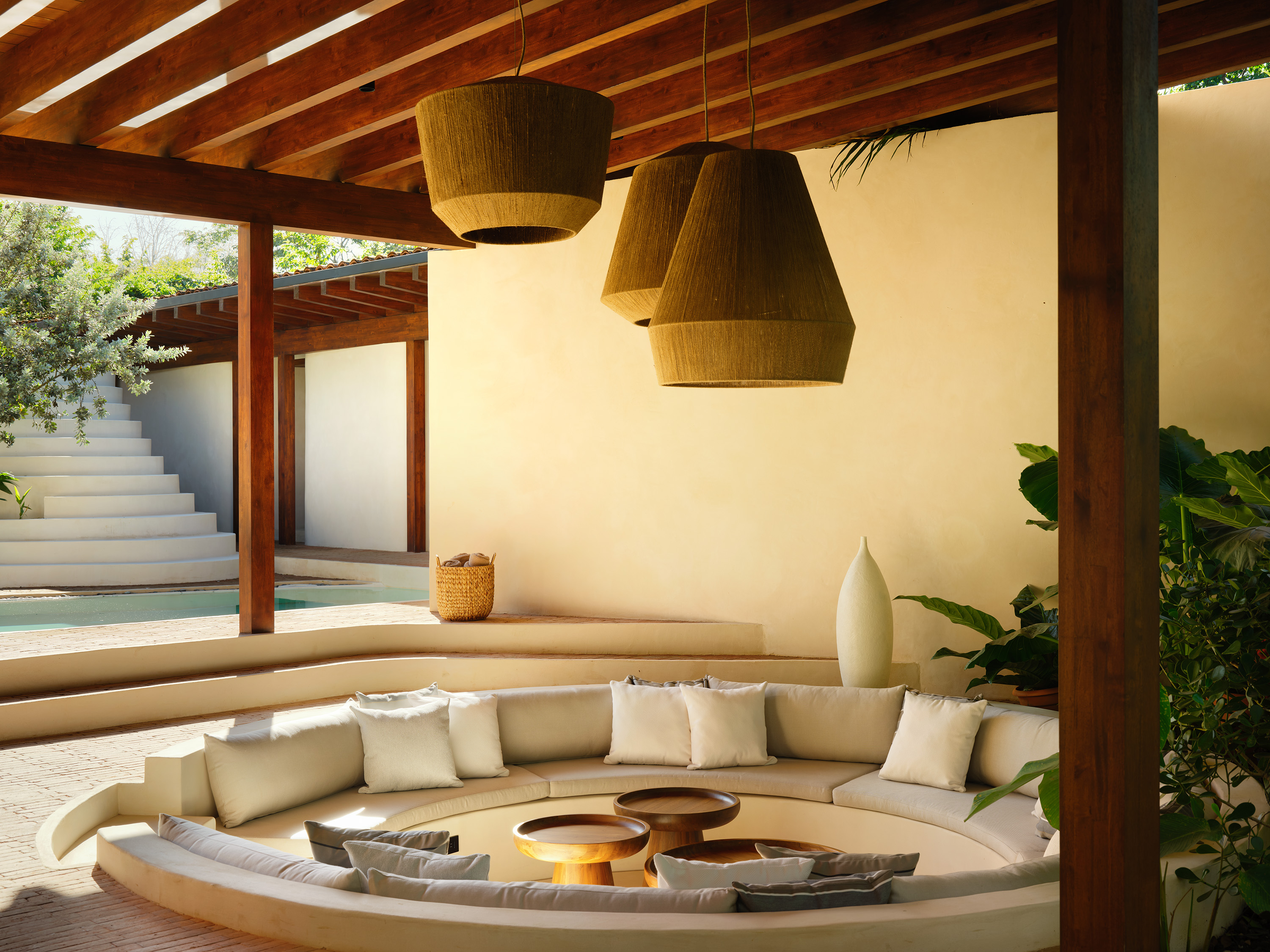 a sculptural Patio house in Costa Rica, textured, low volumes among tropical greenery