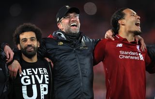 Mohamed Salah, Jurgen Klopp and Virgil van Dijk, l-r, celebrate a dramatic Champions League semi-final win over Barcelona in 2019