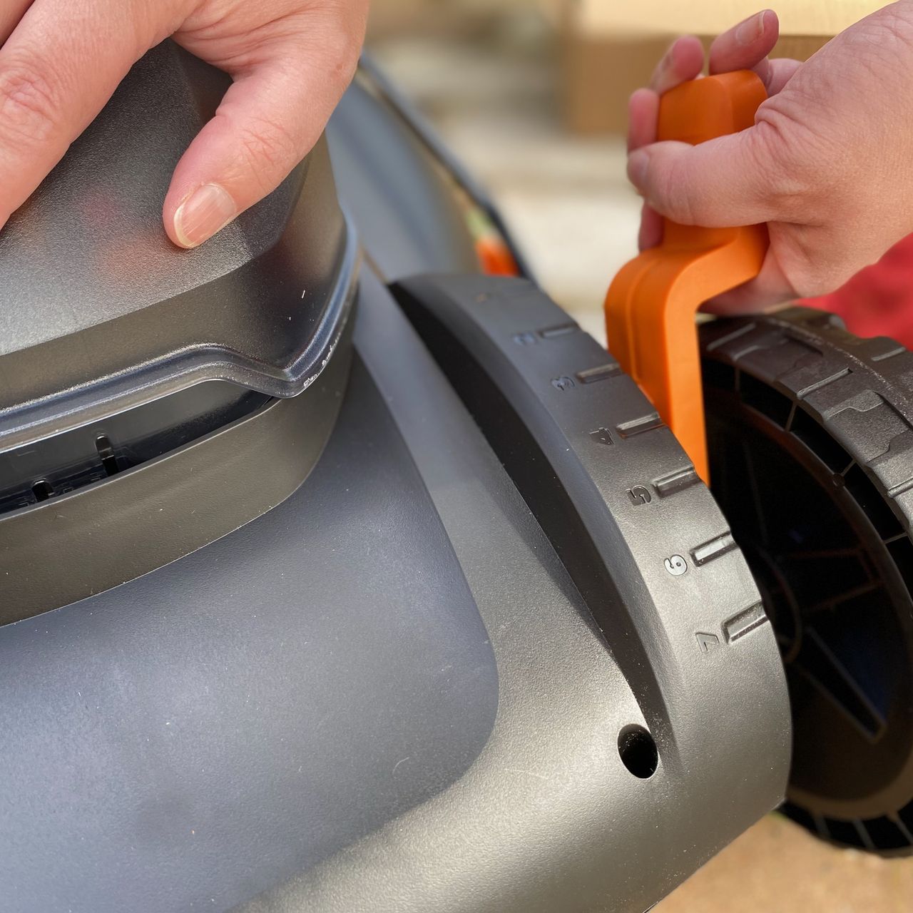 Adjusting the height of the Worx lawn mower