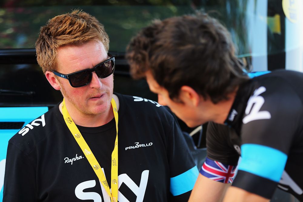 Geraint Thomas of Great Britain and Team Sky (R) talks to Sky Procycling coach Rod Ellingworth ahead of stage during stage three of the 2013 Tour de France