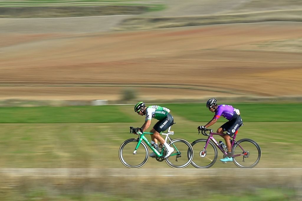 A couple of cyclists ride during the 9th stage of the 2020 La Vuelta cycling tour of Spain a 1577km race from Castrillo del Val to Aguilar de Campoo on October 29 2020 Photo by ANDER GILLENEA AFP Photo by ANDER GILLENEAAFP via Getty Images