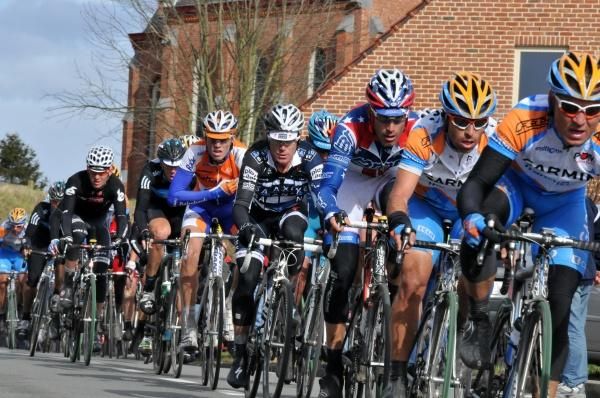 George Hincapie (BMC) and Stuart O'Grady (Saxo Bank) follow the pace set by Garmin-Transitions