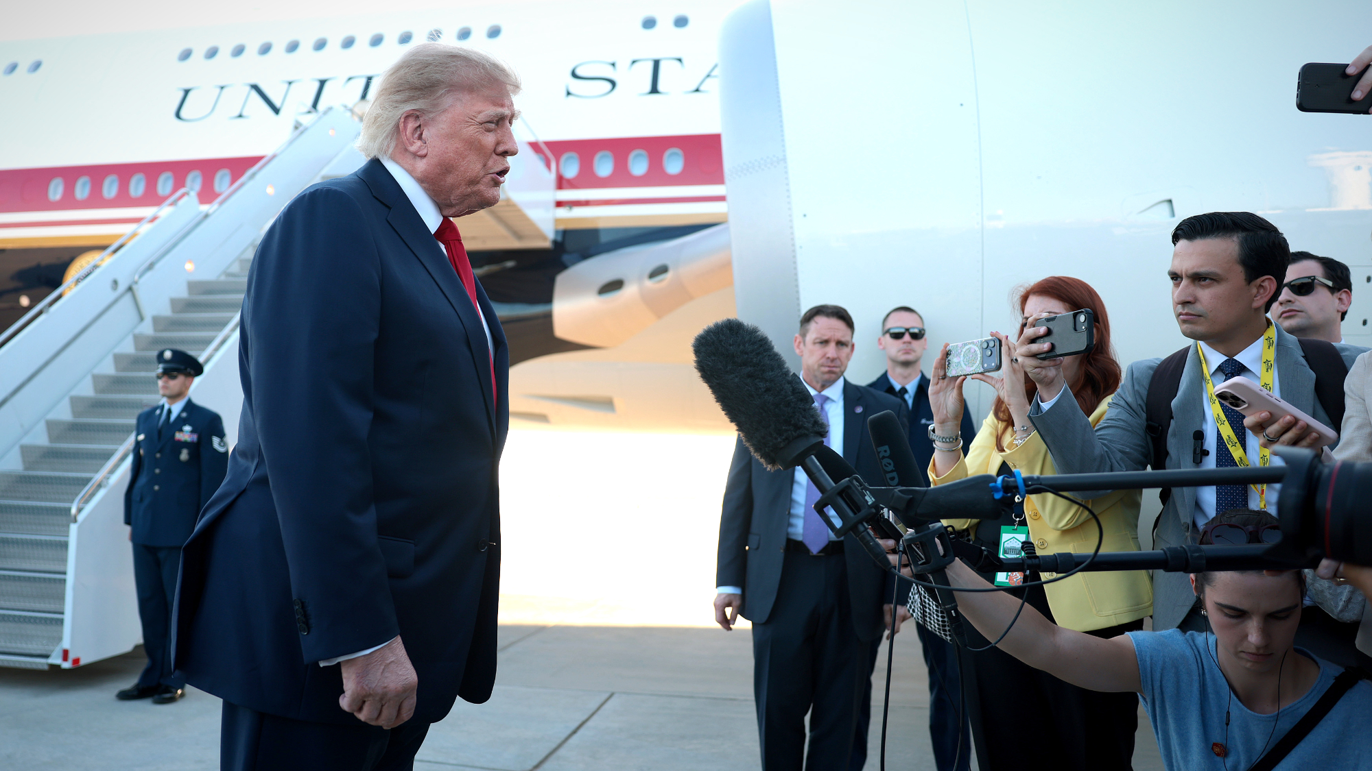 Trump talks to reporters outside of Air Force One