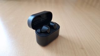 Denon Noise Cancelling Earbuds in case with the lid open