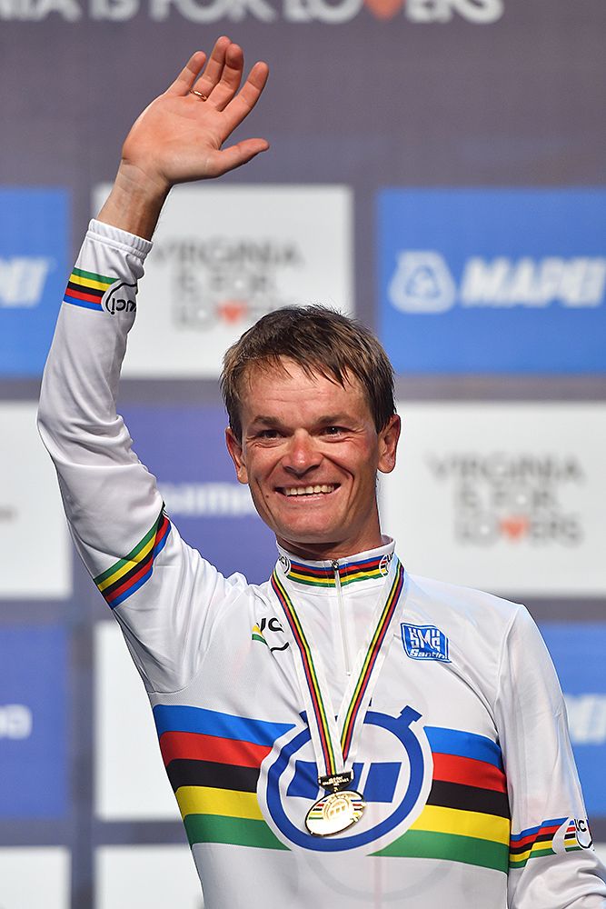 Vasil Kiryienka (Belarus) puts on the rainbow jersey after winning the time trial