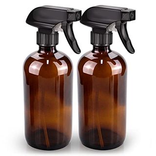 Amber Glass Spray Bottle with black triggers on white background