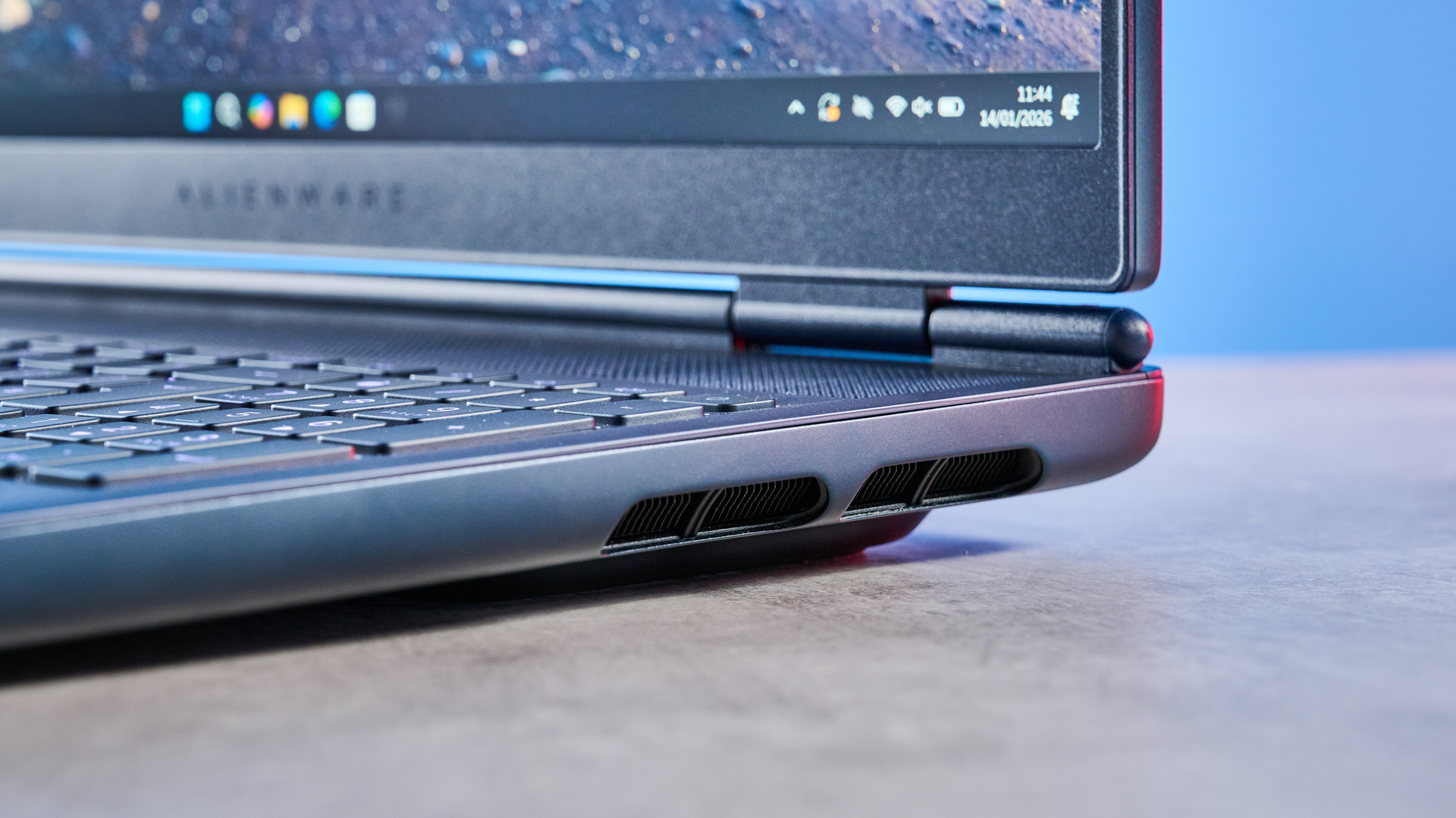 A blue Alienware 16X Aurora gaming laptop