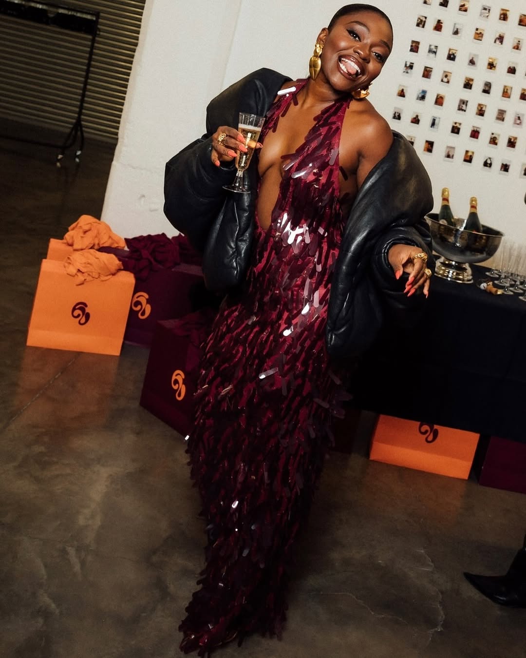 @fisayolonge wears purple sequin dress leather jacket