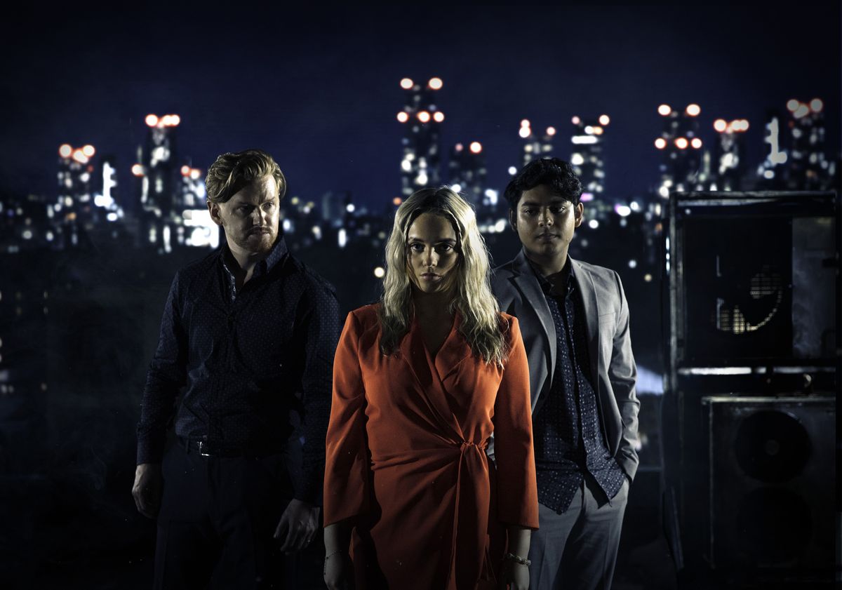 Gary Windass, Kelly Neelan and Aadi Alahan standing on a rooftop in Coronation Street