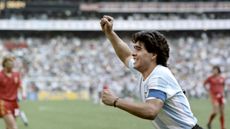 Diego Maradona celebrates after scoring a goal for Argentina. 