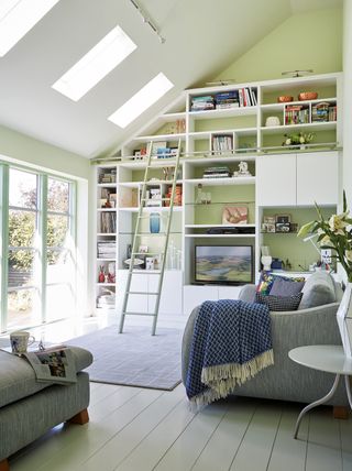 Fitted storage wall in a living space by Neville Johnson