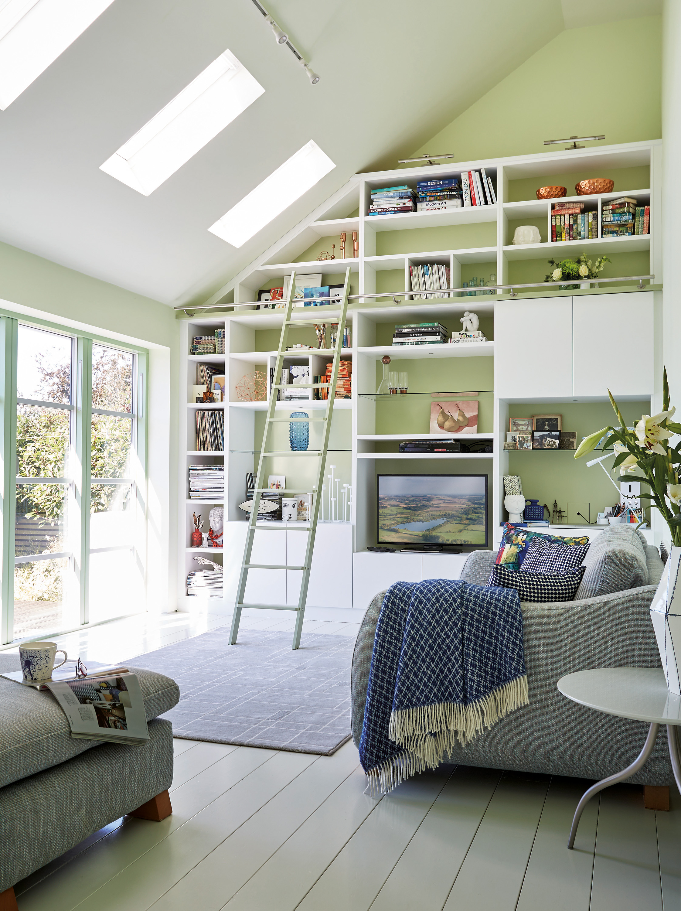 Fitted storage wall in a living space by Neville Johnson