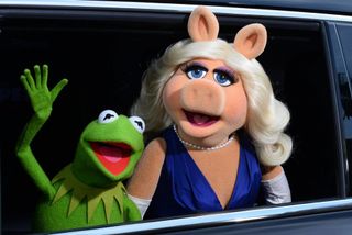 Out of disguise...Kermit and Miss Piggy entering the 'Muppets Haunted Mansion'.