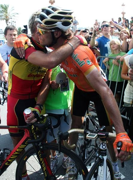 Eighth place finisher Sammy Sanchez (Euskaltel-Euskadi) congratulates Clasica San Sebastian winner Philippe Gilbert (Omega Pharma-Lotto).