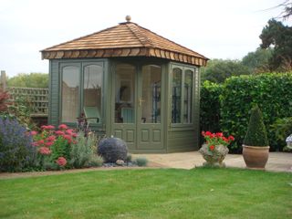 summer house ideas: green summer house from Malvern Garden Buildings